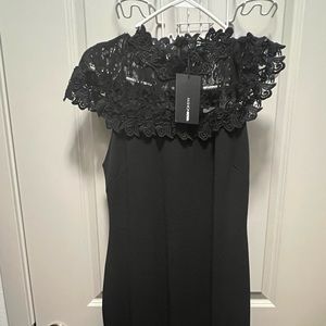 Form fitting Black lace dress.